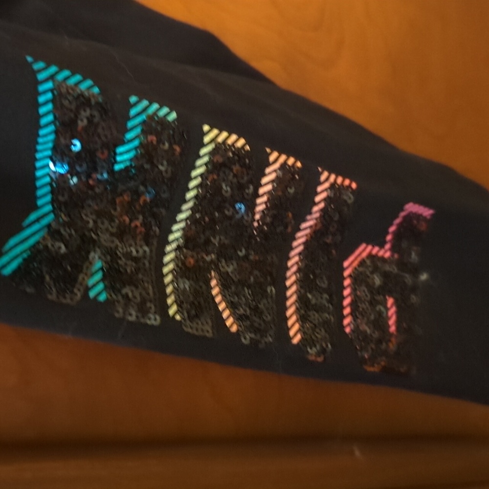 Victoria 's. Secret leggings with the word pink on one leg and cropped phone poc